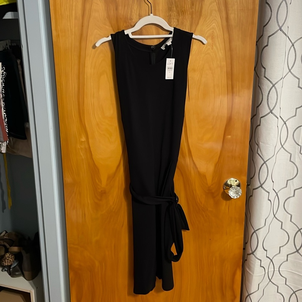 Black dress from Loft. Never worn. Size 14.